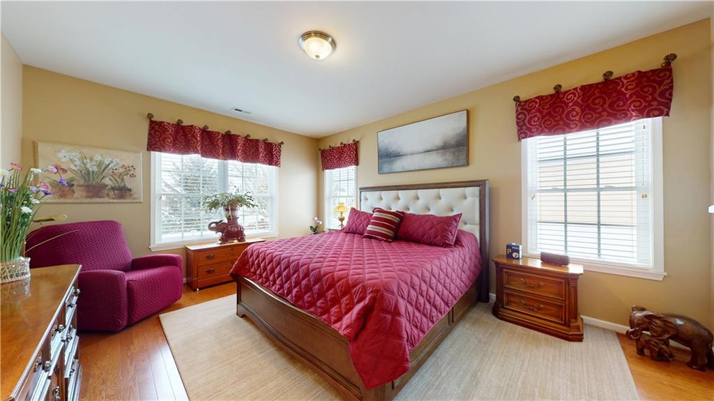 527 Pioneer Lane Freedom, PA 15042 - Photo 17 of 39 a bedroom with a bed and wooden floor