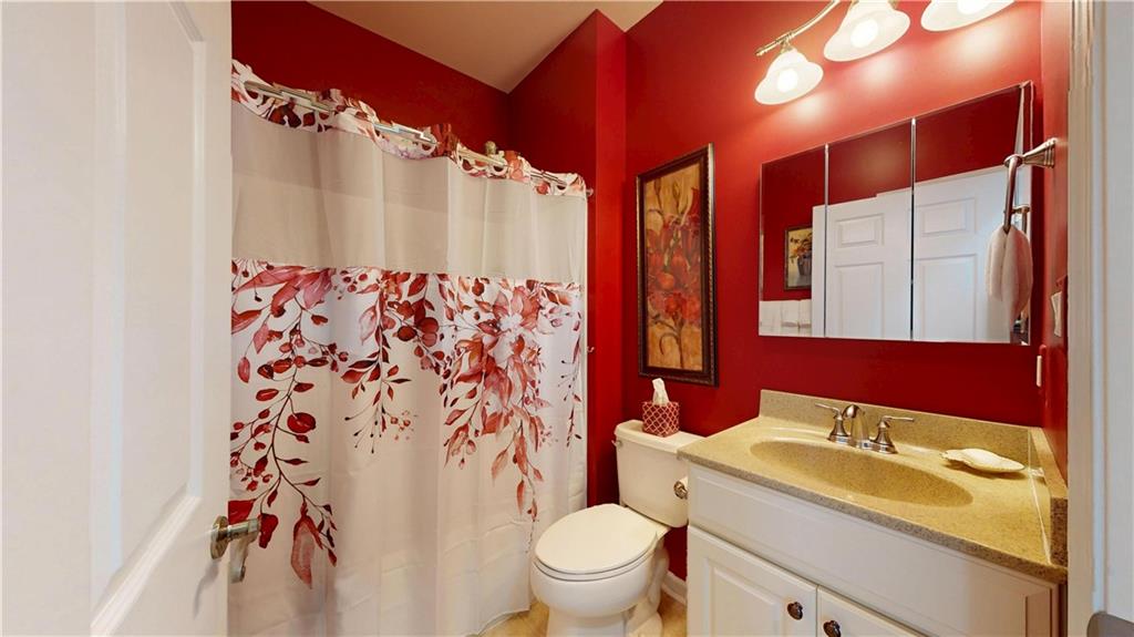 527 Pioneer Lane Freedom, PA 15042 - Photo 24 of 39 a bathroom with a sink a toilet and shower curtain