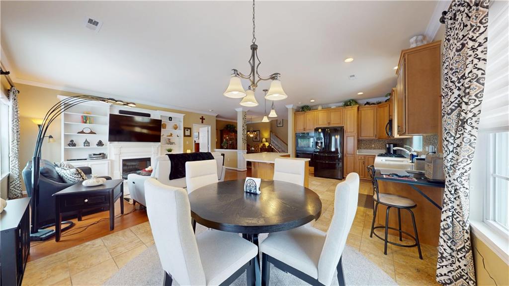 527 Pioneer Lane Freedom, PA 15042 - Photo 3 of 39 a view of a dining room with furniture and wooden floor