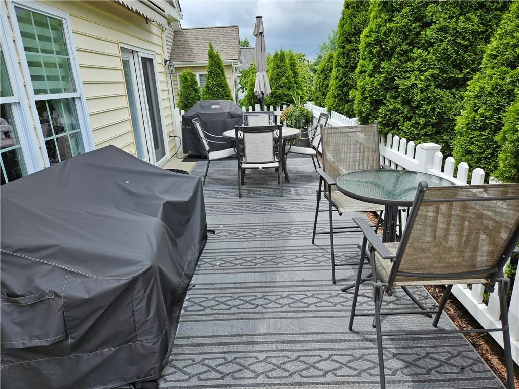 527 Pioneer Lane Freedom, PA 15042 - Photo 31 of 39 a view of a patio with table and chairs with wooden floor and fence
