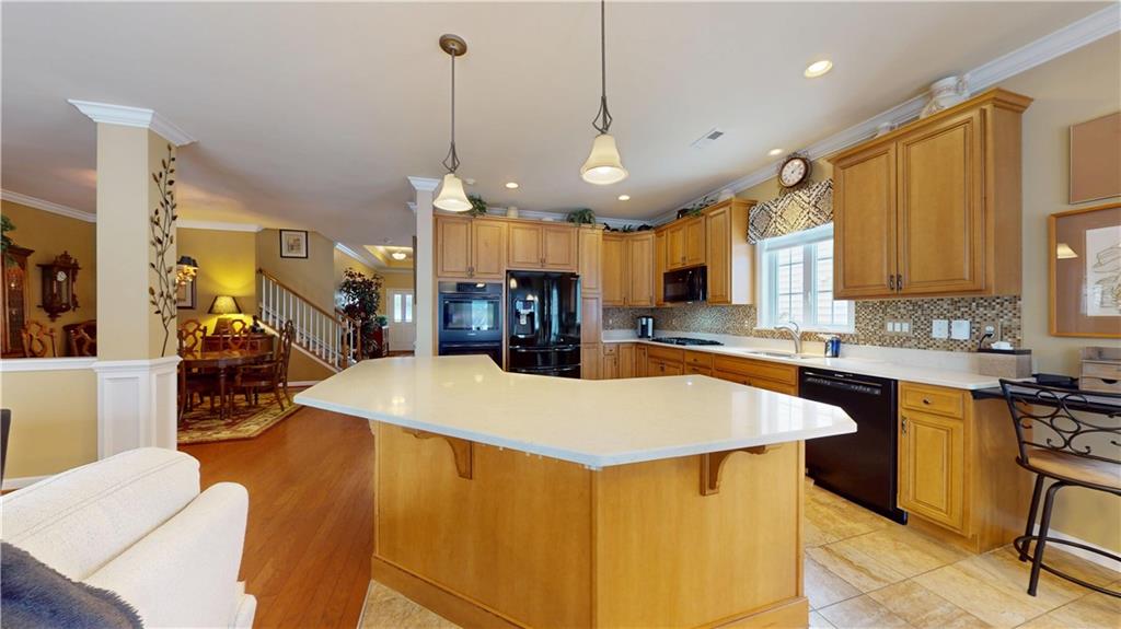527 Pioneer Lane Freedom, PA 15042 - Photo 5 of 39 a large kitchen with kitchen island a large island in it