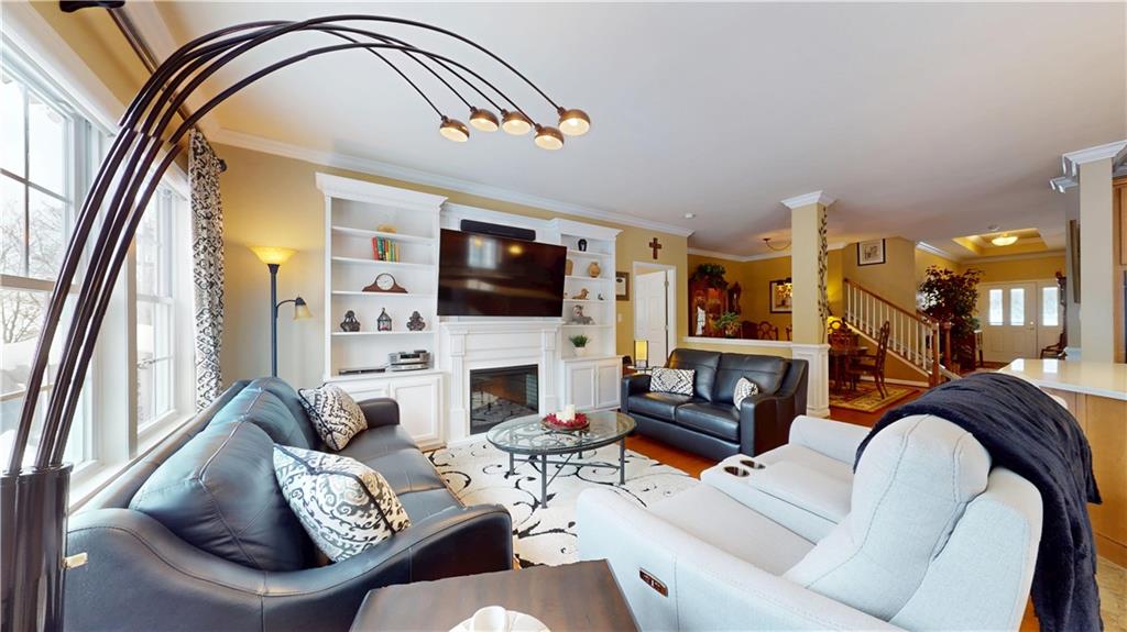 527 Pioneer Lane Freedom, PA 15042 - Photo 9 of 39 a living room with furniture a flat screen tv and a fireplace
