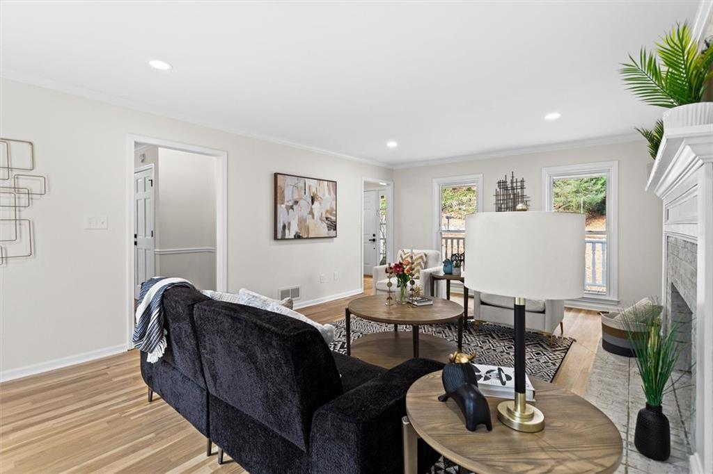 1101 Steeple Run Lawrenceville, GA 30043 - Photo 11 of 70 a living room with furniture and wooden floor