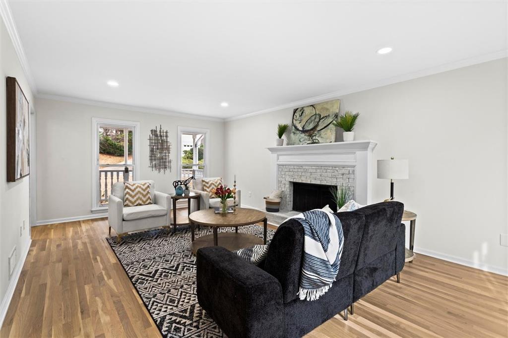 1101 Steeple Run Lawrenceville, GA 30043 - Photo 12 of 70 a living room with furniture and a fireplace