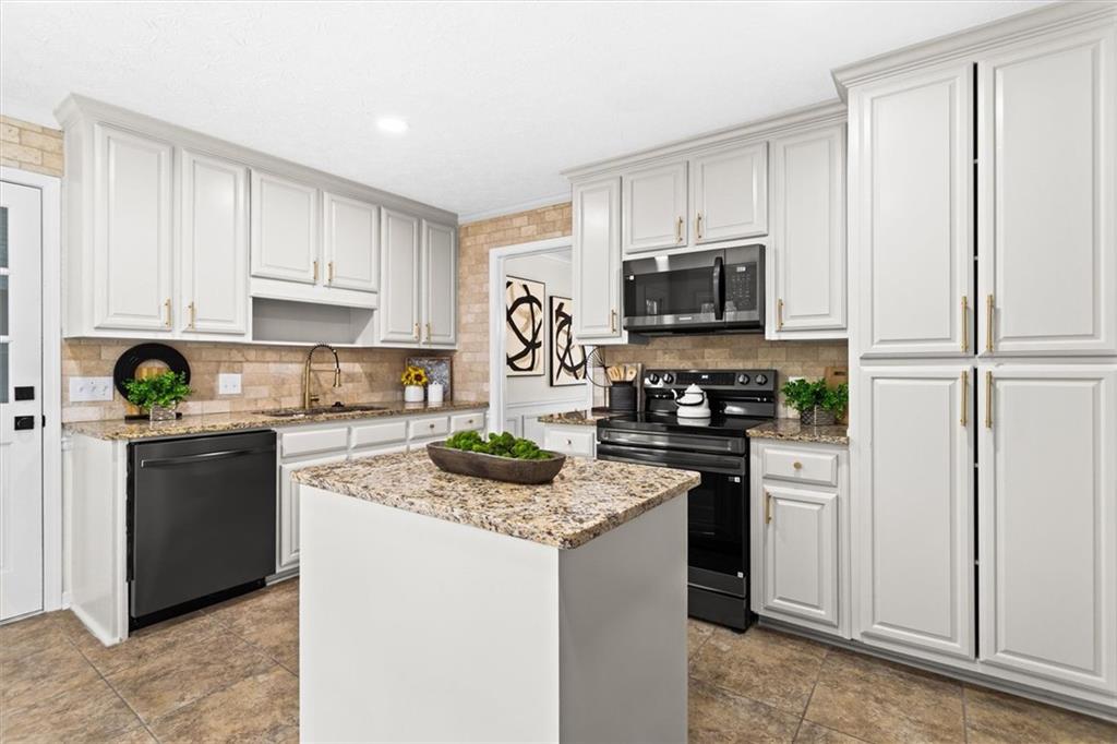 1101 Steeple Run Lawrenceville, GA 30043 - Photo 19 of 70 a kitchen with a refrigerator stove and microwave