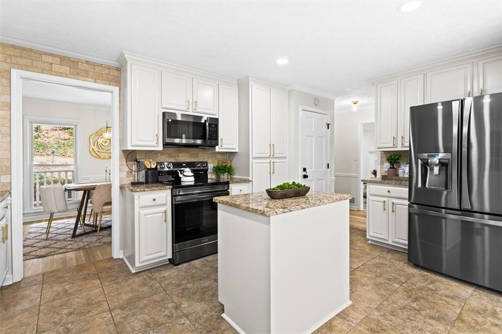 1101 Steeple Run Lawrenceville, GA 30043 - Photo 20 of 70 a kitchen with a refrigerator stove and microwave