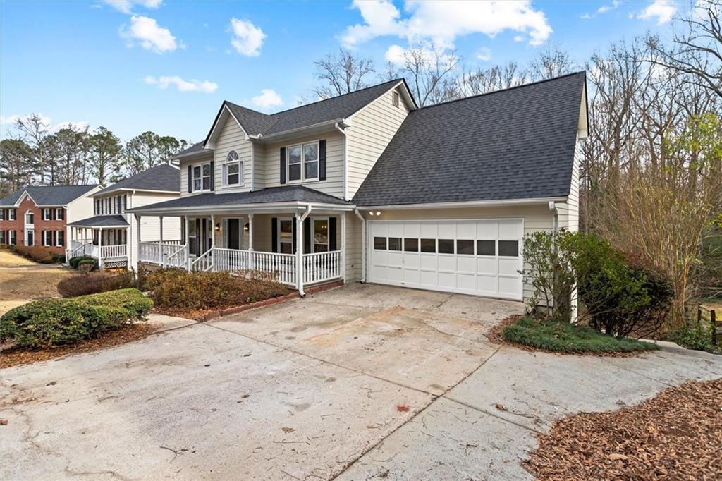 1101 Steeple Run Lawrenceville, GA 30043 - Photo 2 of 70 a view of a house with a garden