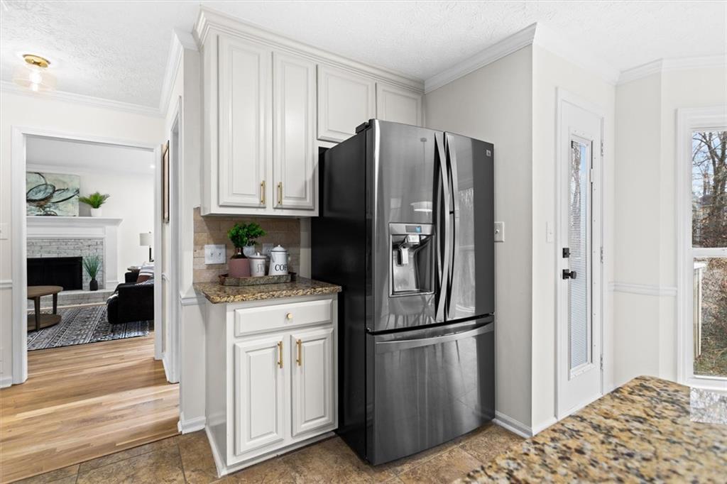 1101 Steeple Run Lawrenceville, GA 30043 - Photo 24 of 70 a kitchen with stainless steel appliances granite countertop a refrigerator and a stove top oven