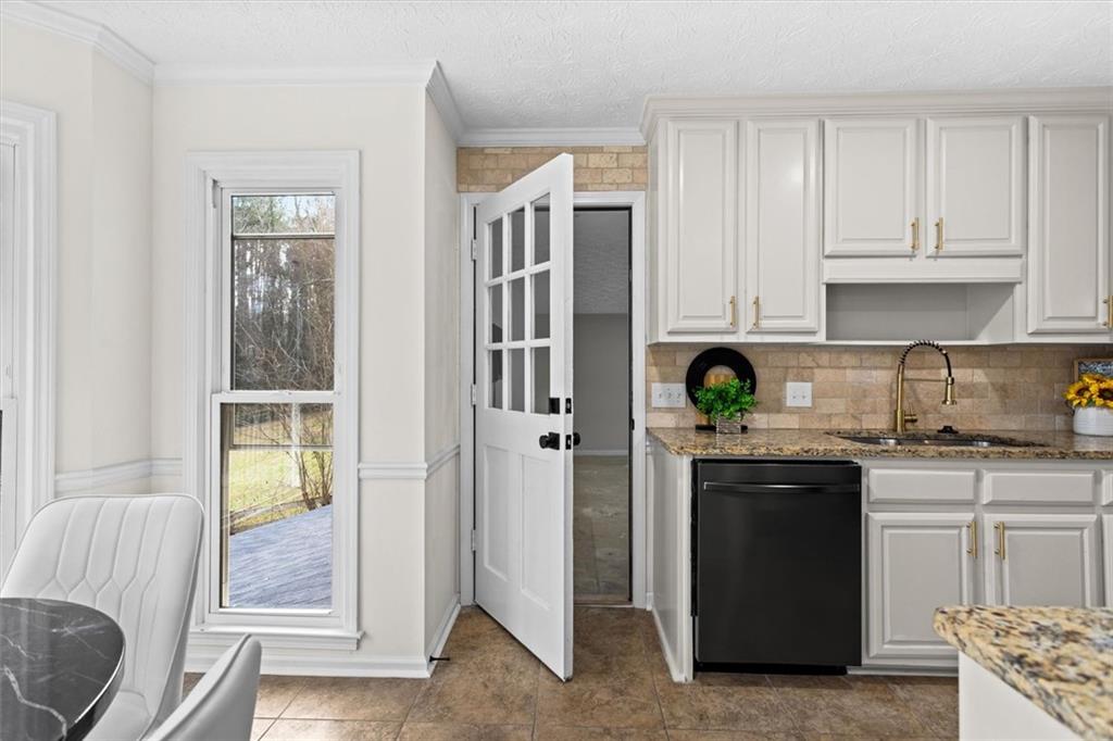 1101 Steeple Run Lawrenceville, GA 30043 - Photo 32 of 70 a kitchen with stainless steel appliances granite countertop a refrigerator and a stove top oven