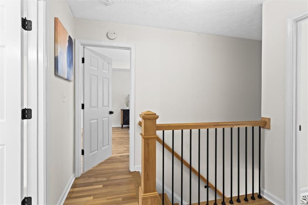 1101 Steeple Run Lawrenceville, GA 30043 - Photo 37 of 70 a view of a hallway with wooden floor