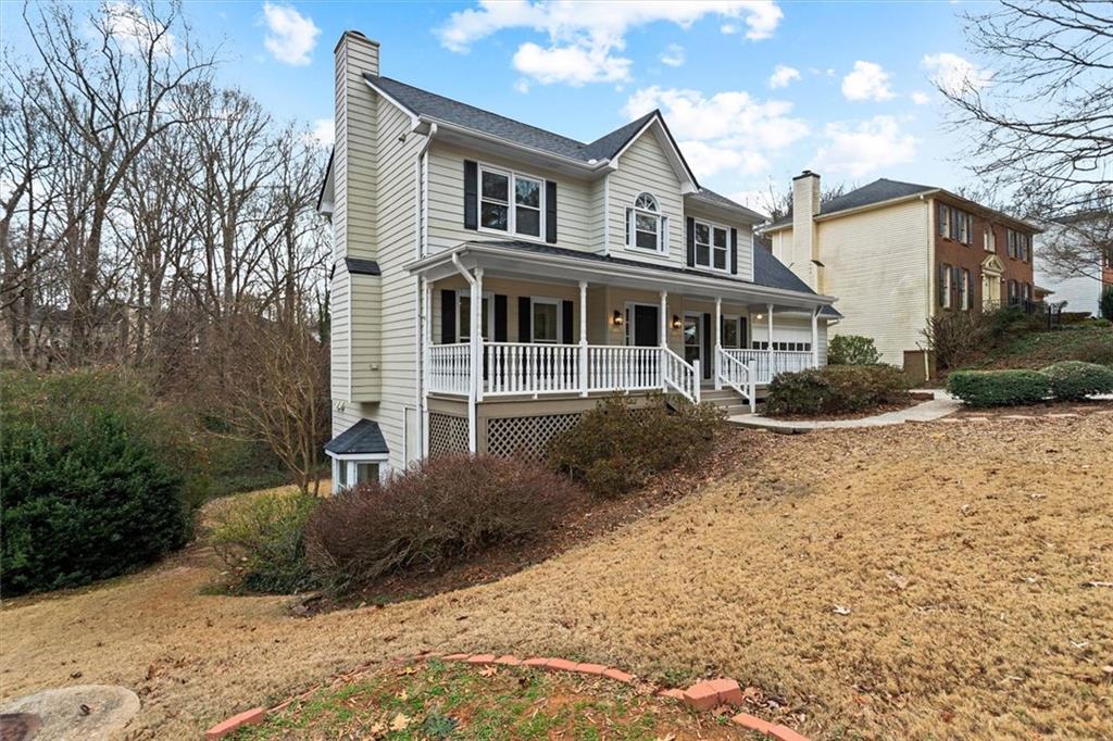 1101 Steeple Run Lawrenceville, GA 30043 - Photo 4 of 70 a front view of a house with a yard