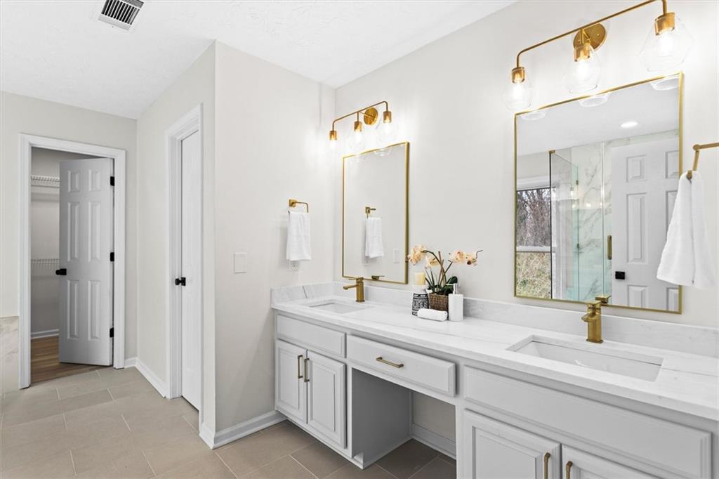 1101 Steeple Run Lawrenceville, GA 30043 - Photo 43 of 70 a bathroom with double sink and a mirror
