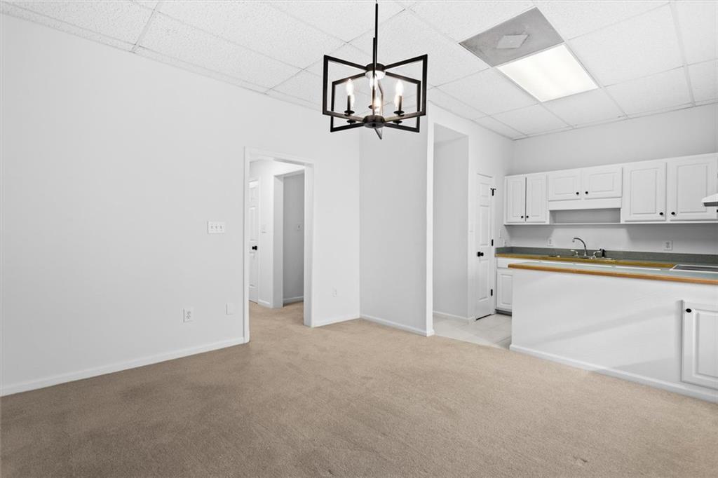 1101 Steeple Run Lawrenceville, GA 30043 - Photo 59 of 70 a view of a kitchen with a sink and cabinets