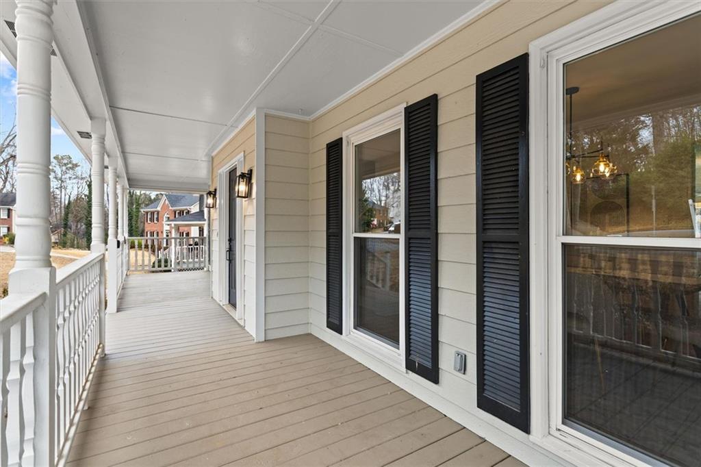 1101 Steeple Run Lawrenceville, GA 30043 - Photo 6 of 70 a view of a hallway with wooden floor and livingroom