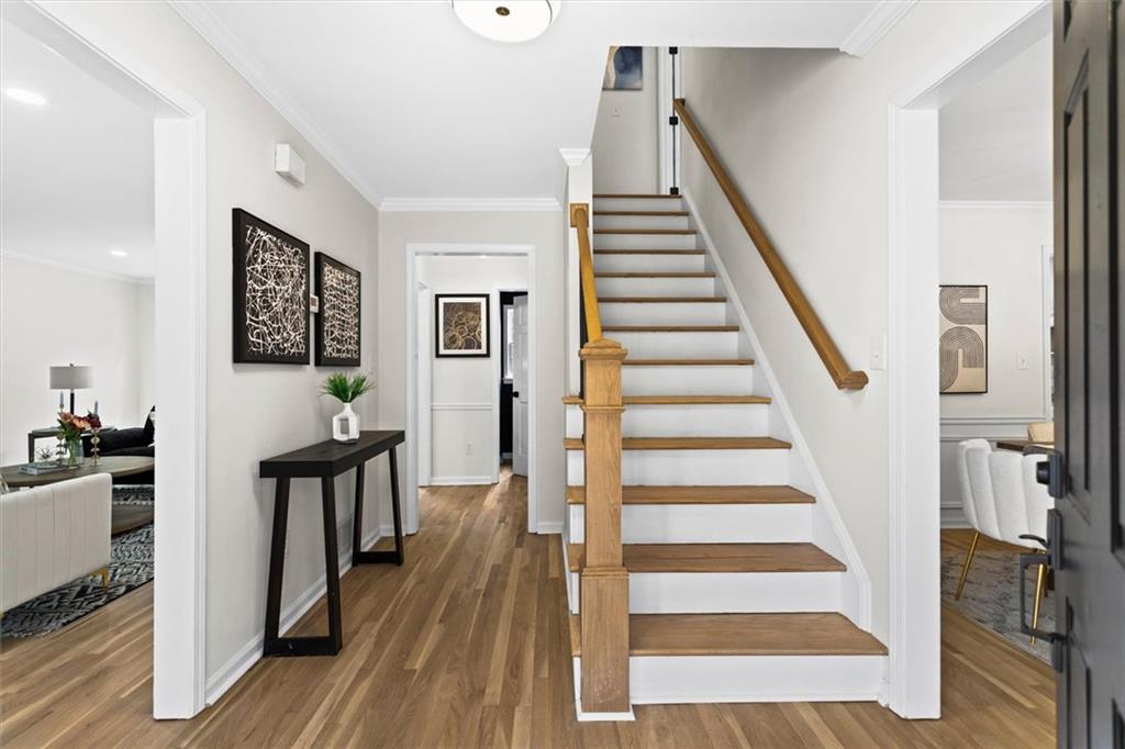1101 Steeple Run Lawrenceville, GA 30043 - Photo 8 of 70 a view of a hallway with wooden floor and staircase