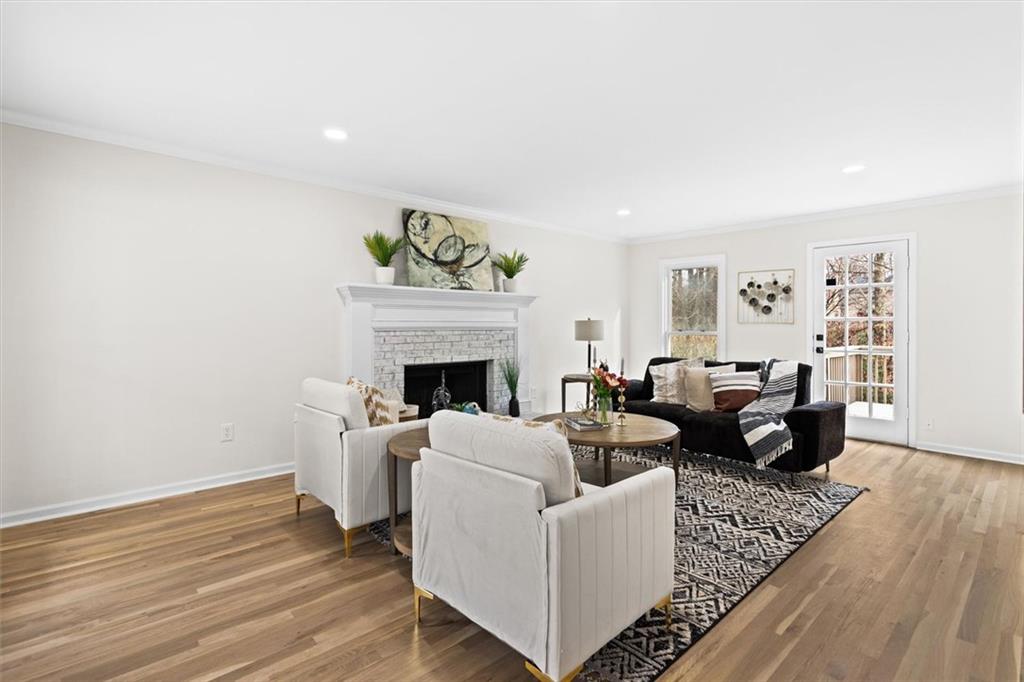 1101 Steeple Run Lawrenceville, GA 30043 - Photo 10 of 70 a living room with furniture and a fireplace