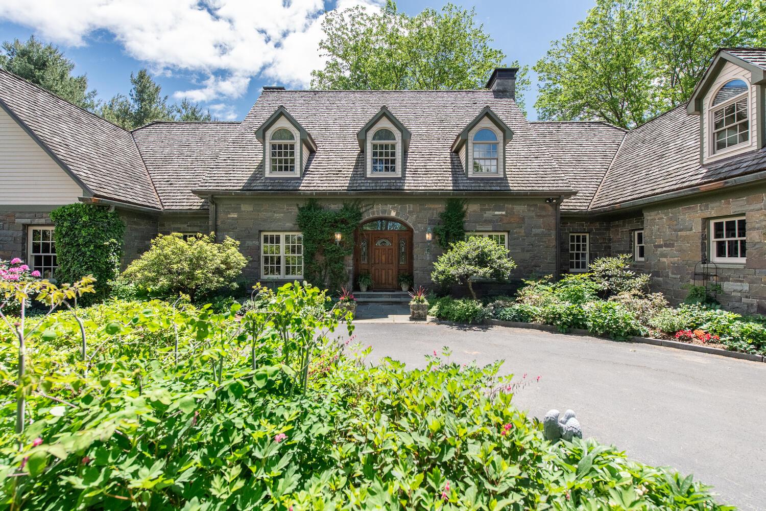 a front view of a house with lots of yellow lighting