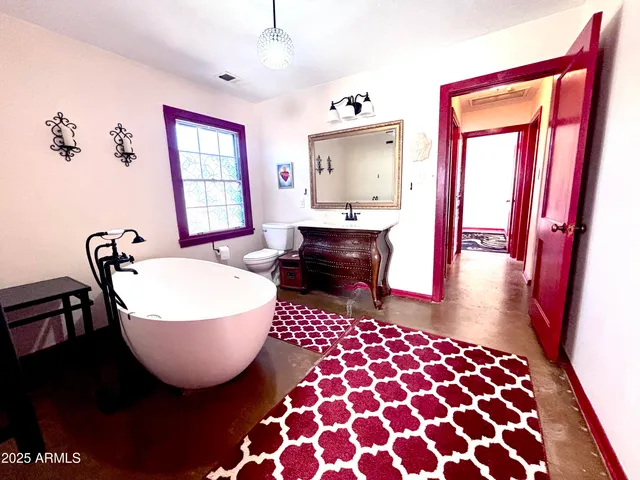 a living room with furniture and a rug