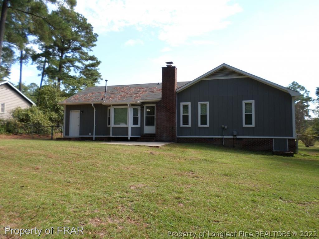 6712 Vaughn Road Fayetteville, NC 28304 - Photo 18 of 19 a front view of a house with garden