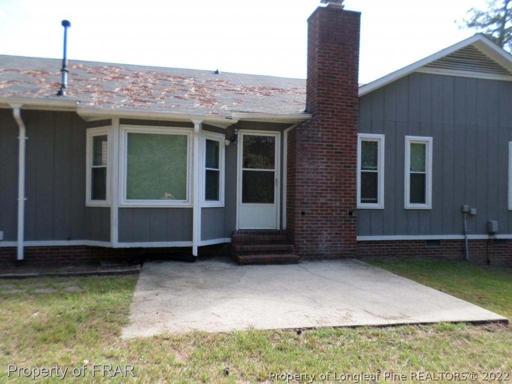 6712 Vaughn Road Fayetteville, NC 28304 - Photo 19 of 19 a front view of a house with a garden