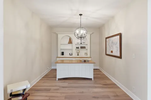 a view of living room with wooden floor and window