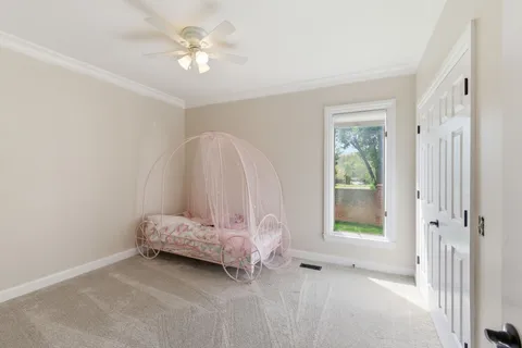 a view of room with stairs and a chandelier fan