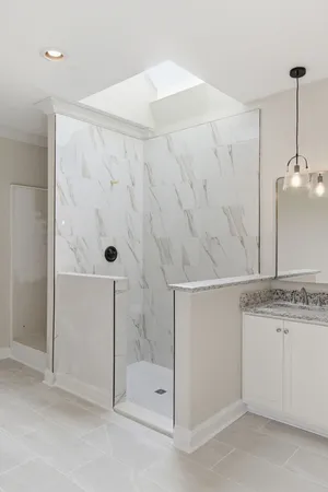 a bathroom with a shower and a sink