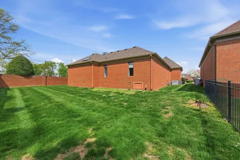 a backyard of a house with lots of green space
