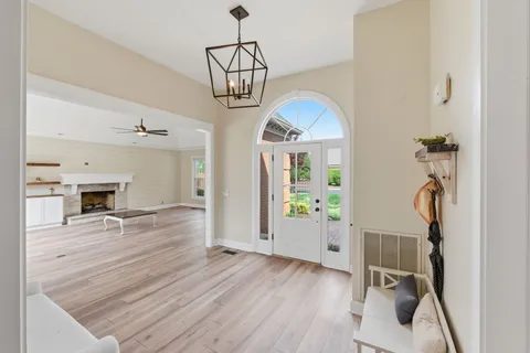 a view of a livingroom with furniture and a ceiling fan