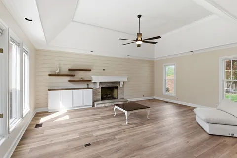 a living room with furniture and a fireplace