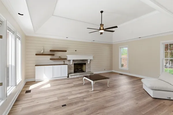 a living room with furniture and a fireplace