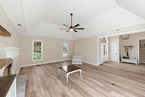 a view of room with window hardwood floor and ceiling fan