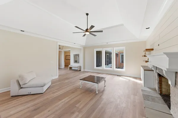 a living room with furniture and a fireplace