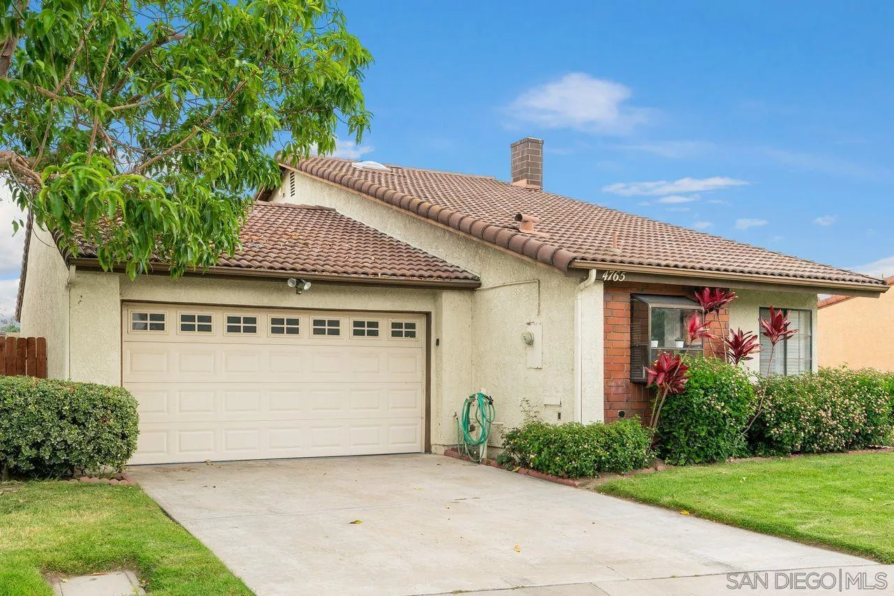 4765 Adler Way Oceanside, CA 92057 - Photo 1 of 33 a front view of a house with garden