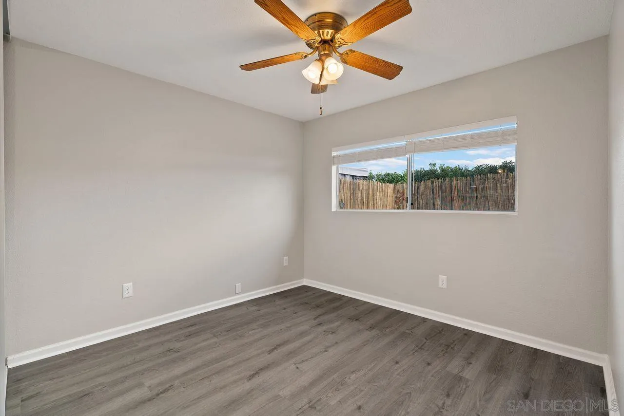 4765 Adler Way Oceanside, CA 92057 - Photo 23 of 33 wooden floor in an empty room with a window