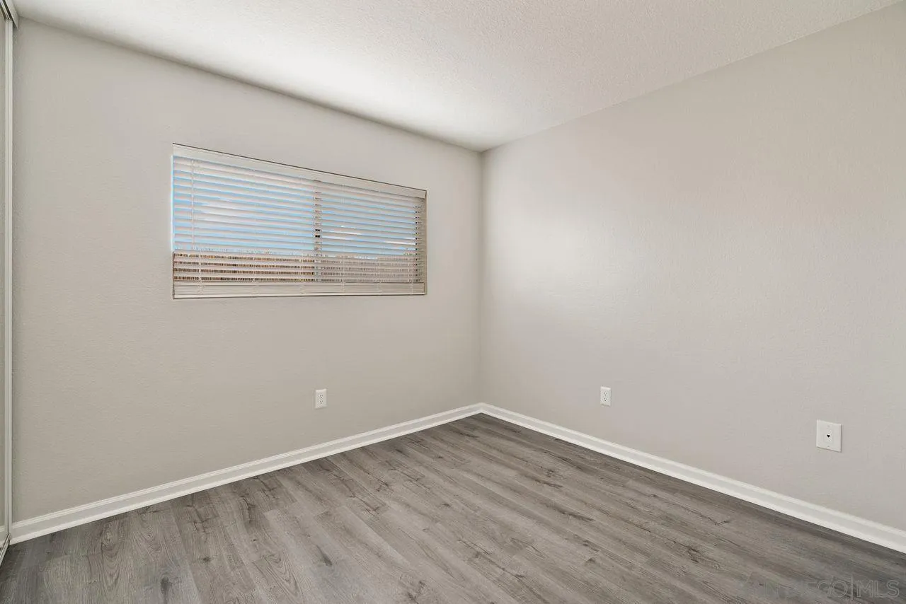 4765 Adler Way Oceanside, CA 92057 - Photo 24 of 33 wooden floor in an empty room with a window