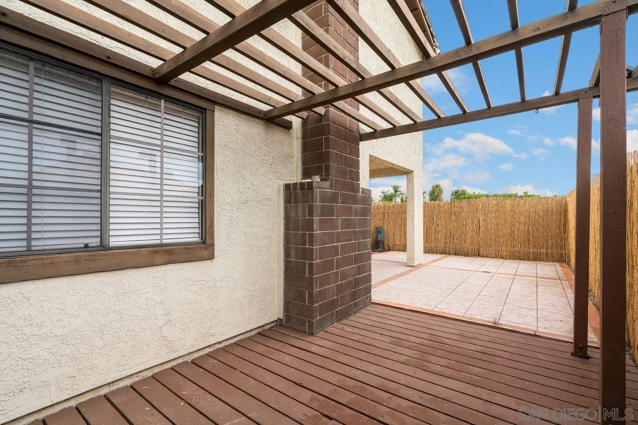 4765 Adler Way Oceanside, CA 92057 - Photo 26 of 33 a view of empty room with wooden floor and windows