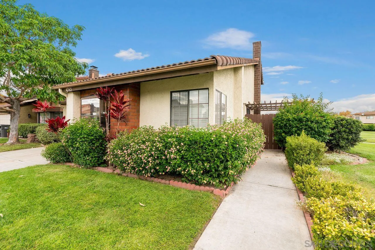 4765 Adler Way Oceanside, CA 92057 - Photo 33 of 33 a white house with a small yard and plants