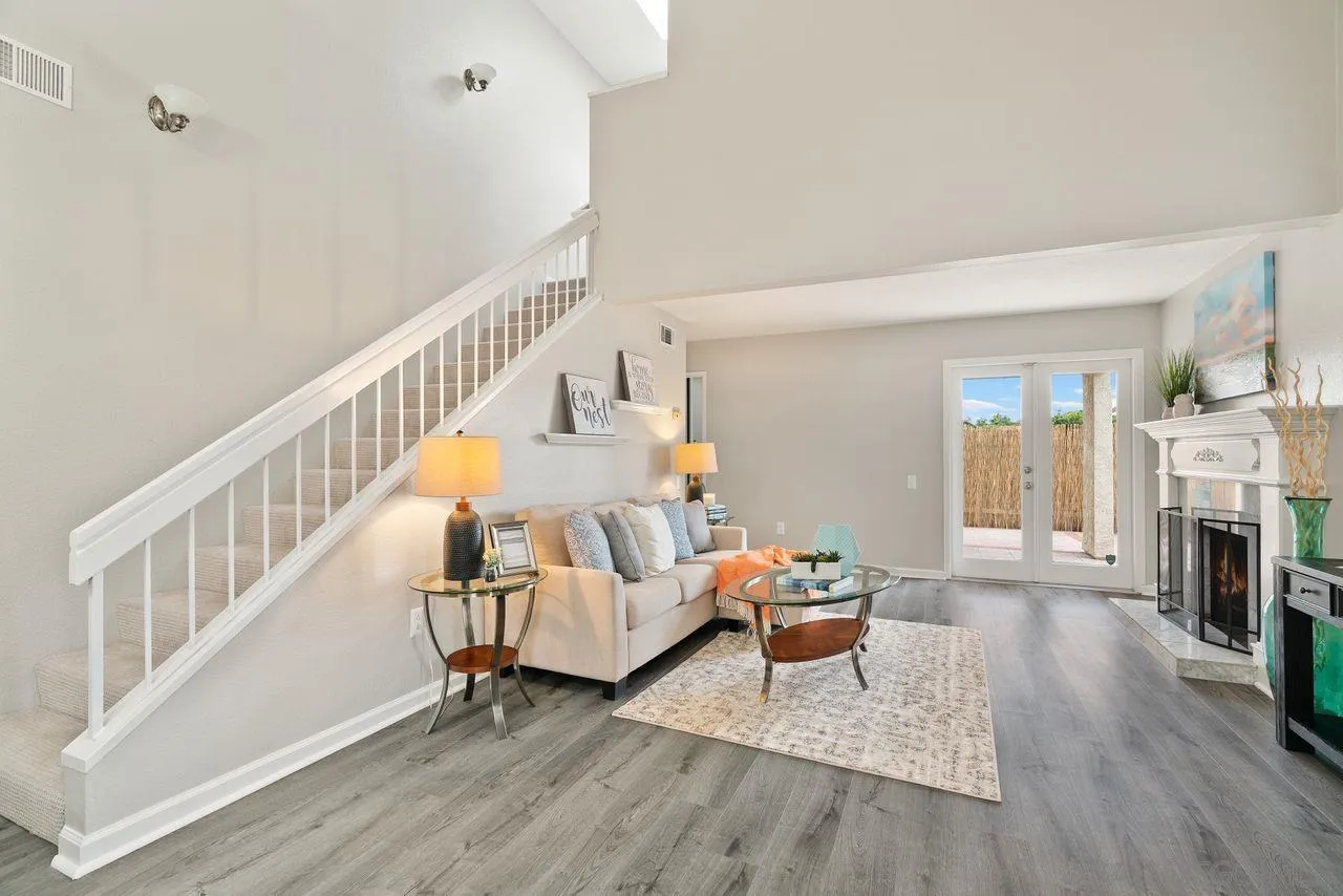 4765 Adler Way Oceanside, CA 92057 - Photo 5 of 33 a living room with fireplace furniture and a wooden floor