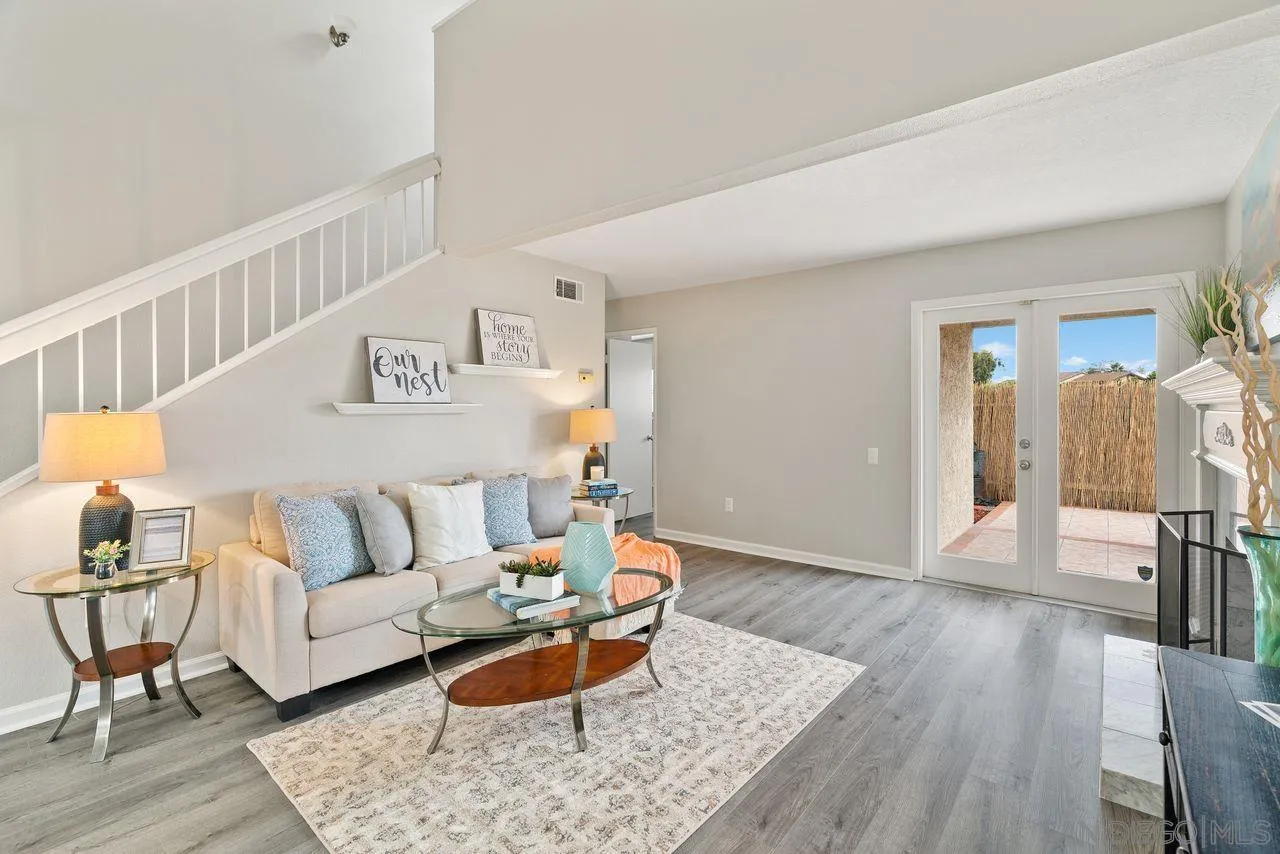 4765 Adler Way Oceanside, CA 92057 - Photo 7 of 33 a living room with furniture and wooden floor