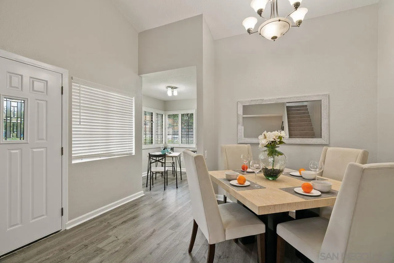 4765 Adler Way Oceanside, CA 92057 - Photo 10 of 33 a view of a dining room with furniture window and wooden floor