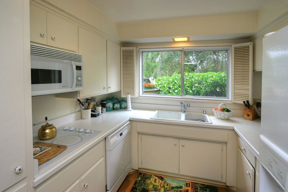 5726 Encina Road, Unit 2 Santa Barbara, CA 93117 - Photo 5 of 9 a kitchen with a sink stove and cabinets
