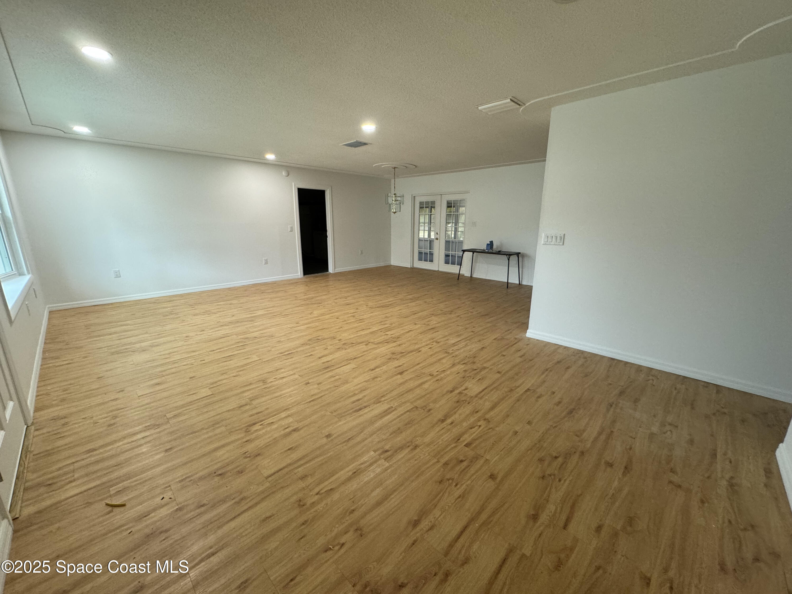 34 East Azalea Circle Rockledge, FL 32955 - Photo 3 of 11 a view of empty room with wooden floor