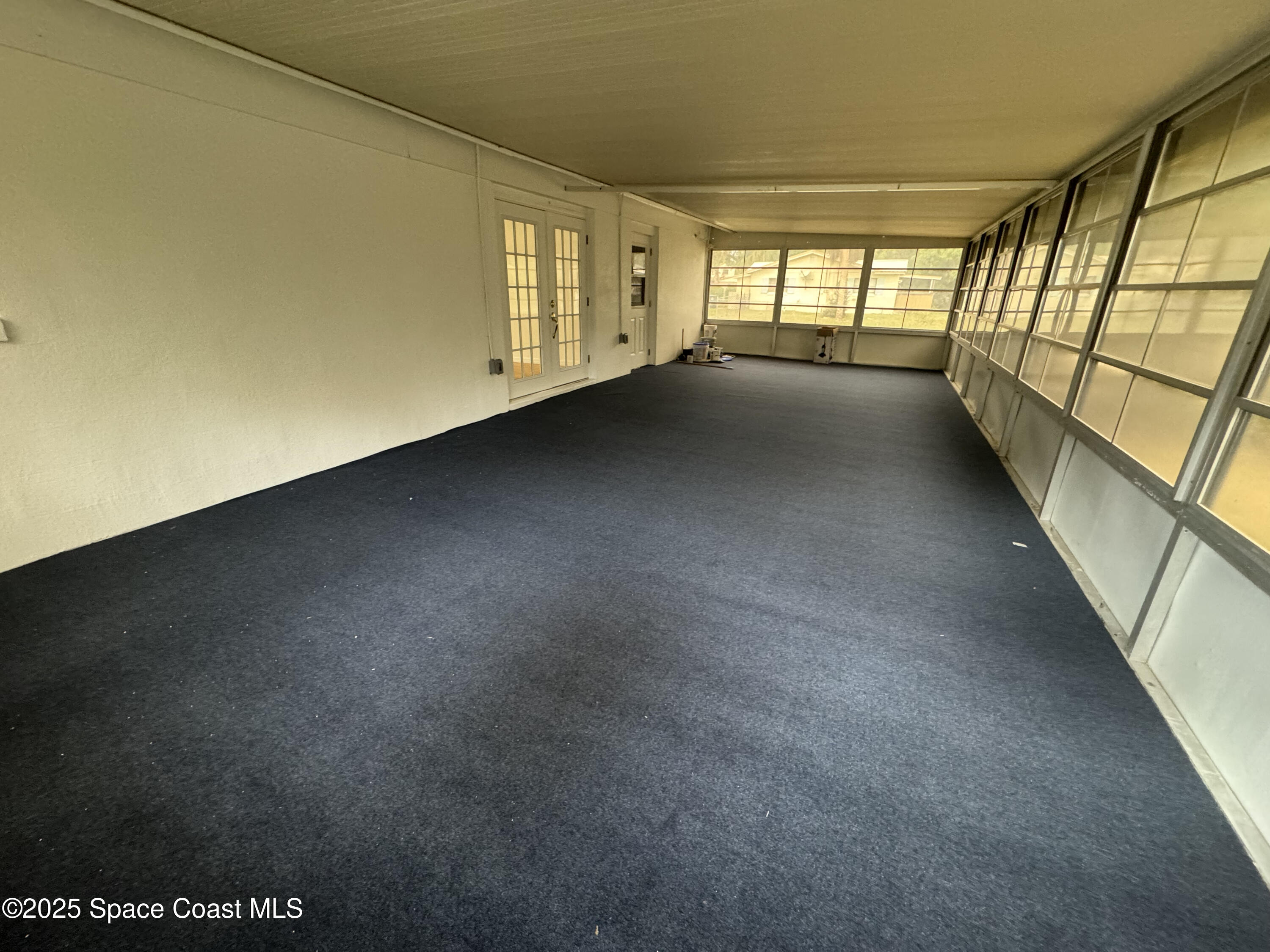 34 East Azalea Circle Rockledge, FL 32955 - Photo 5 of 11 a view of an empty room with a window