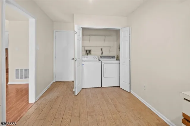 a view of a kitchen from the hallway