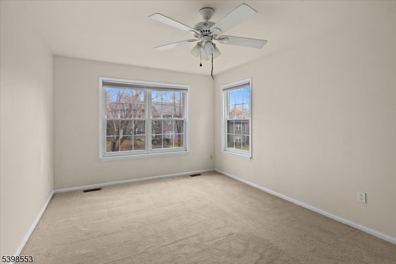 36 Needham Way, Unit D Princeton, NJ 08540 - Photo 20 of 30 an empty room with windows and fan