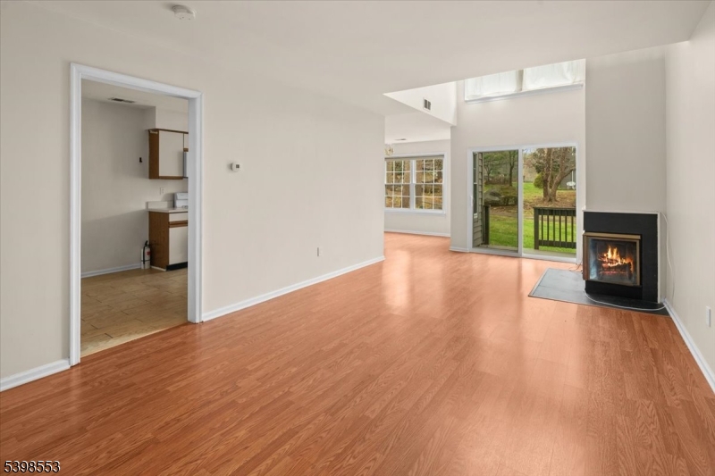 36 Needham Way, Unit D Princeton, NJ 08540 - Photo 7 of 30 a view of a room with wooden floor and a fireplace