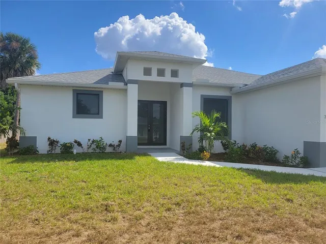 a view of a house with swimming pool and porch