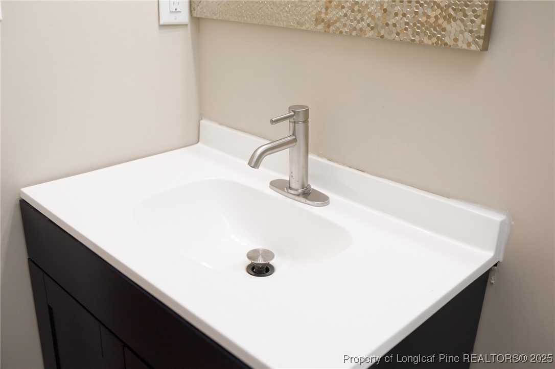 212 Heflin Road Aberdeen, NC 28315 - Photo 14 of 23 a close view of bathroom sink