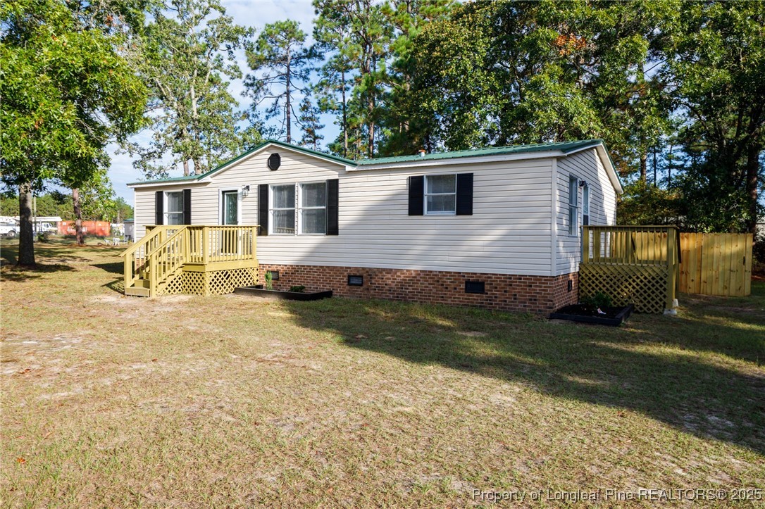 212 Heflin Road Aberdeen, NC 28315 - Photo 2 of 23 a front view of a house with a yard